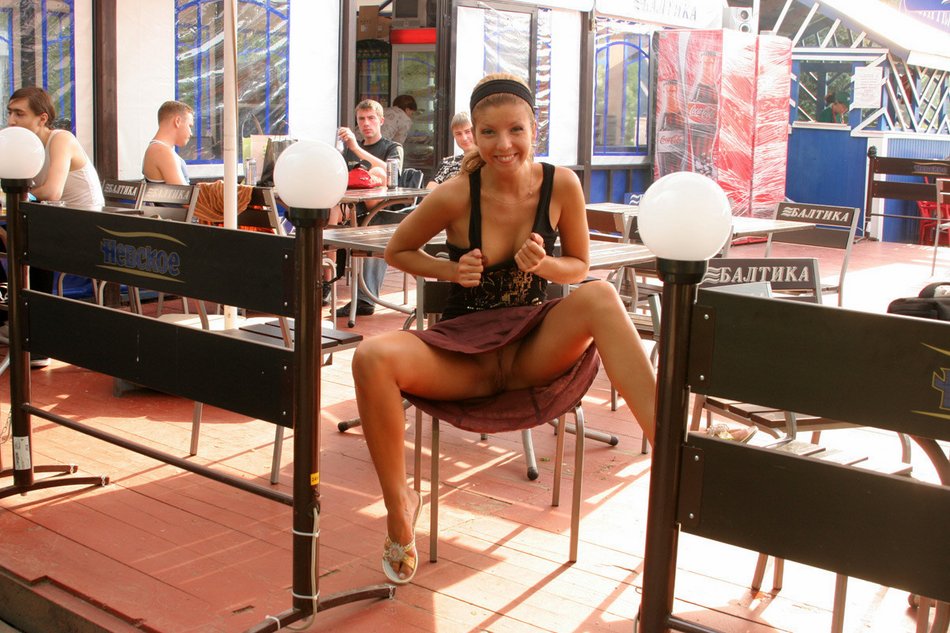 Girl Flashing Pussy at a Table in Public